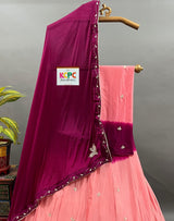 A pink and purple traditional Indian lehenga with cutdana handwork 