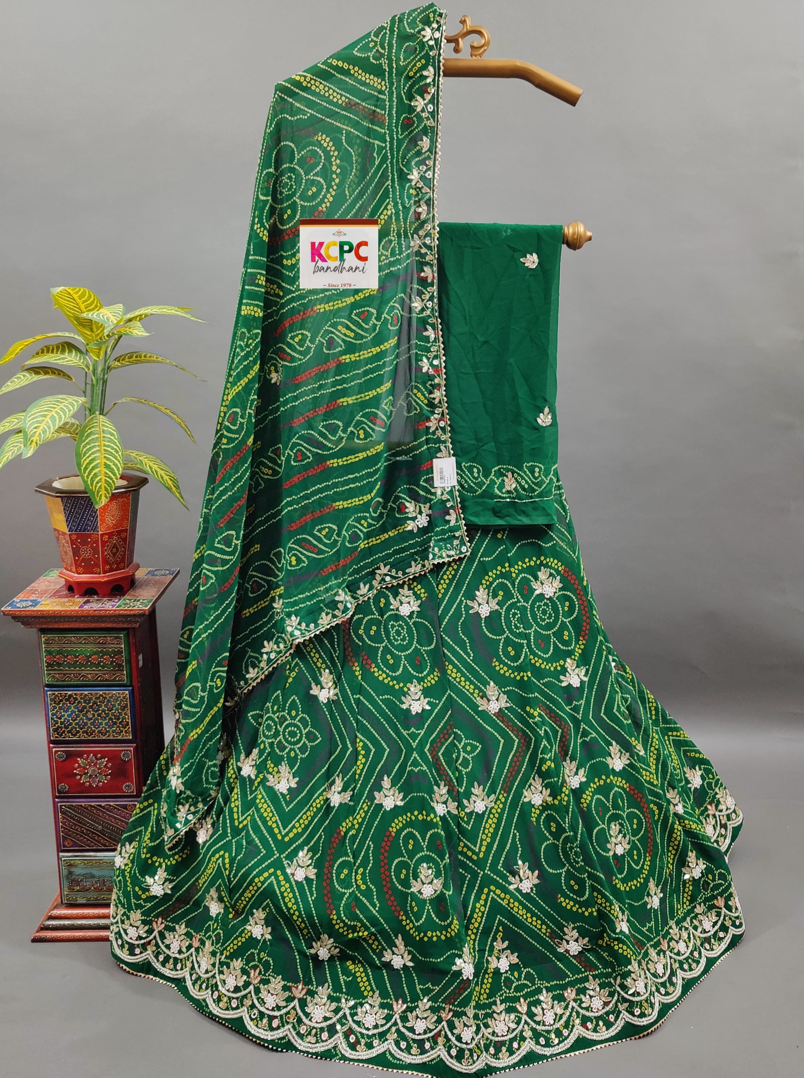A green georgette lehenga with gotapati work