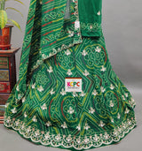 A green georgette lehenga with gotapati work