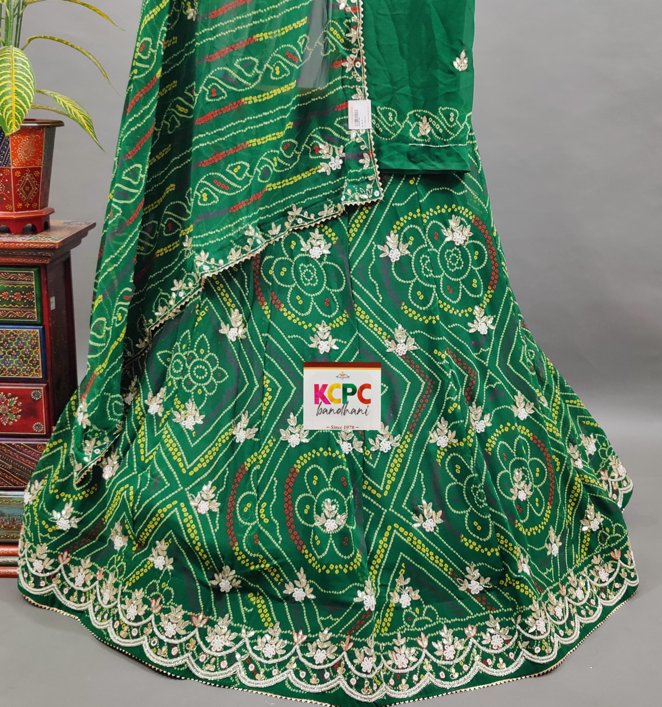A green georgette lehenga with gotapati work