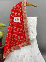 A white Dola silk lehenga with gold handwork