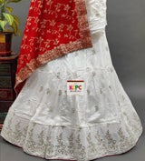 A white Dola silk lehenga with gold handwork
