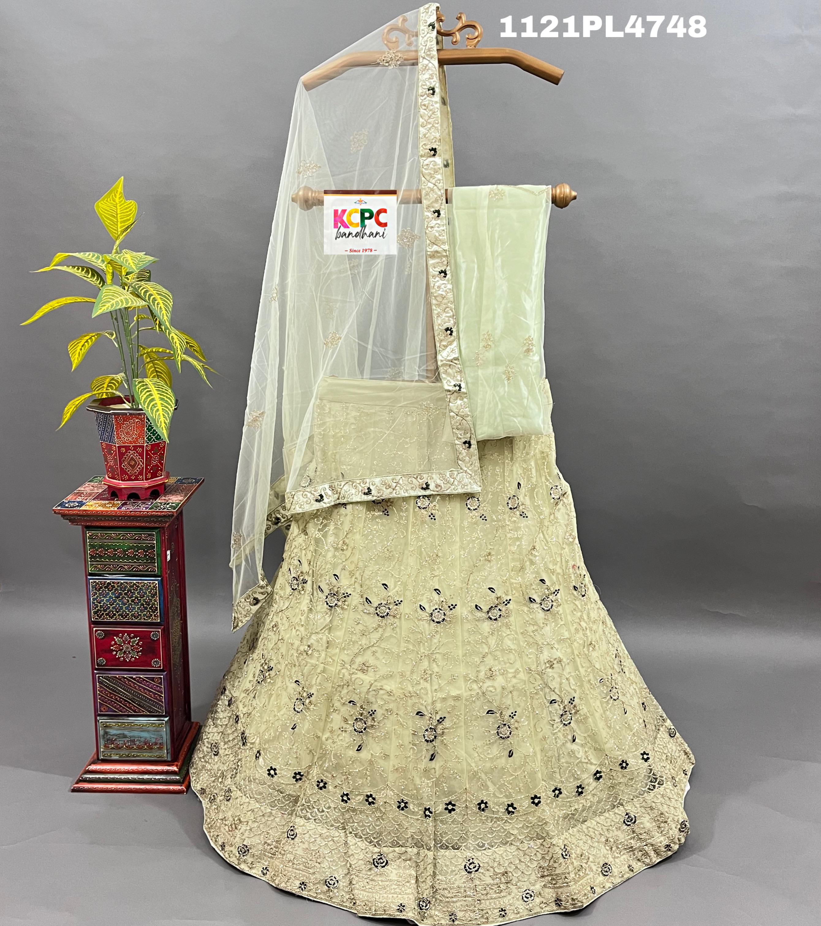 A traditional Indian lehenga set with embroidery and sequins work