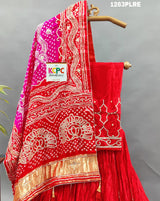 A red and pink silk lehenga with bandhani style 