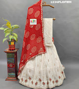 A red and white traditional lehenga set with dupatta and gota work 