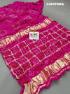 A pink silk bandhani gharchola saree 