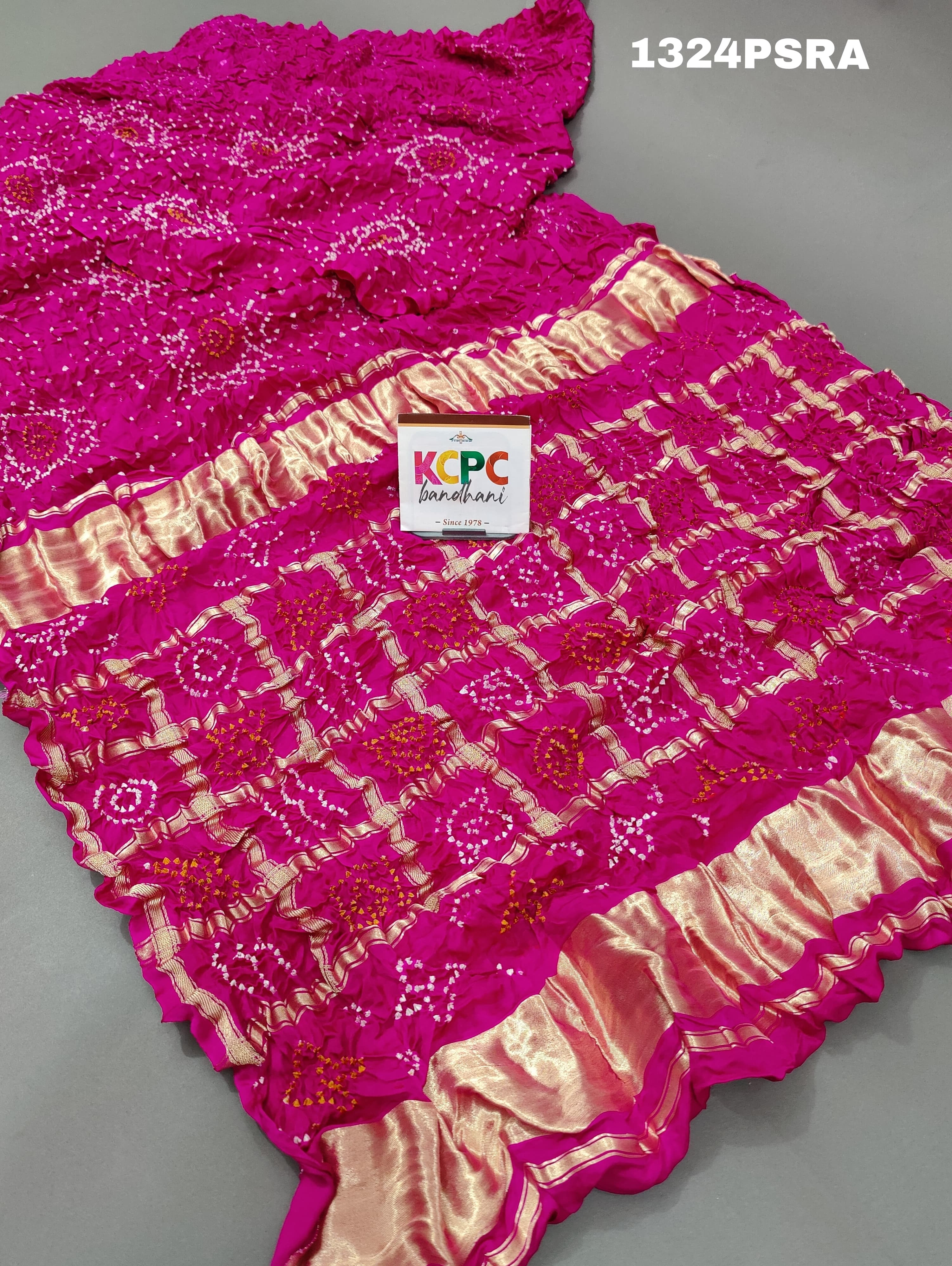 A pink silk bandhani gharchola saree 