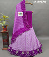 A purple lehenga with double shade bandhani cutdana work