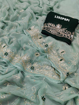 A traditional Rajputi saree in a light green color