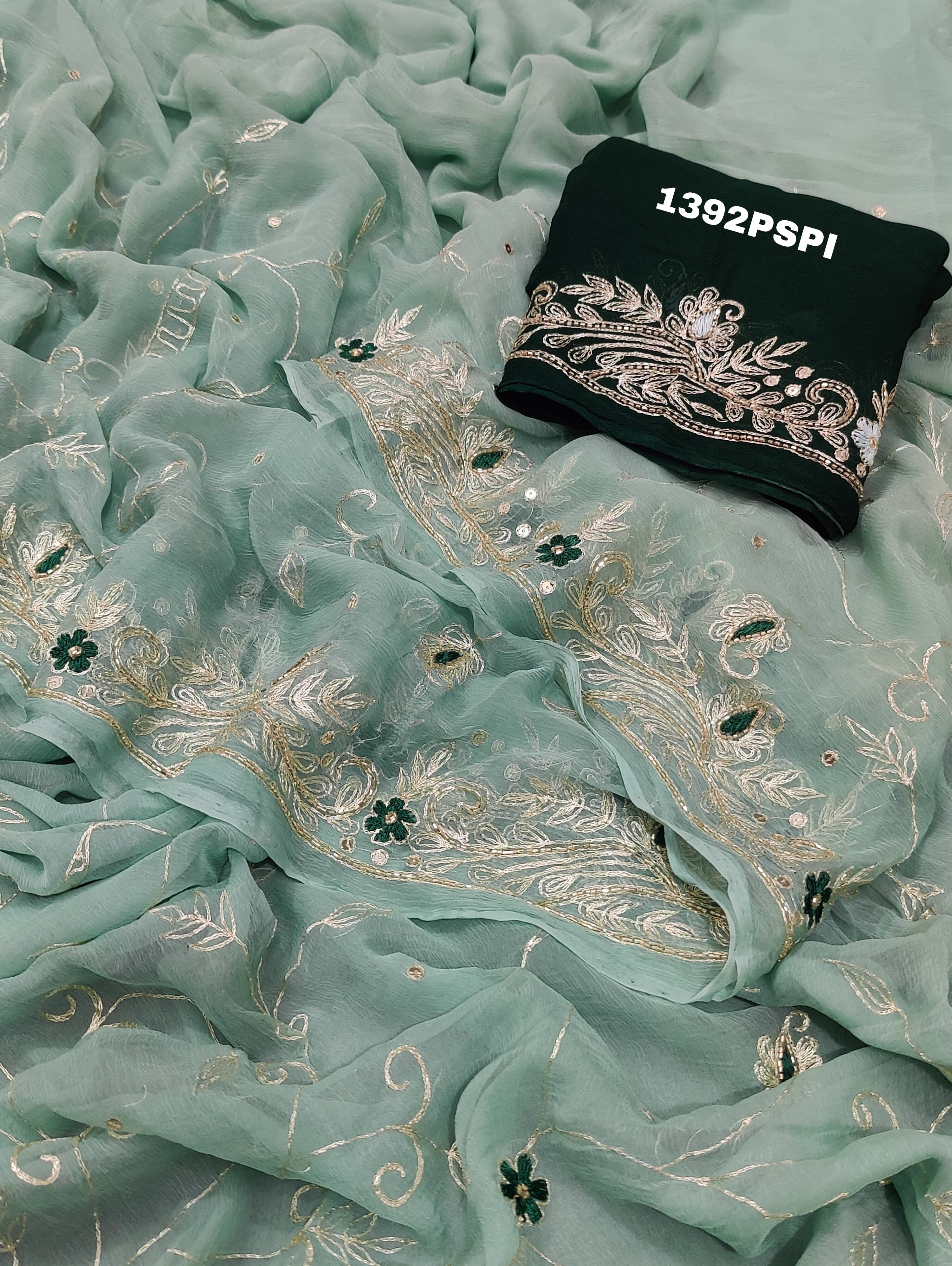 A traditional Rajputi saree in a light green color