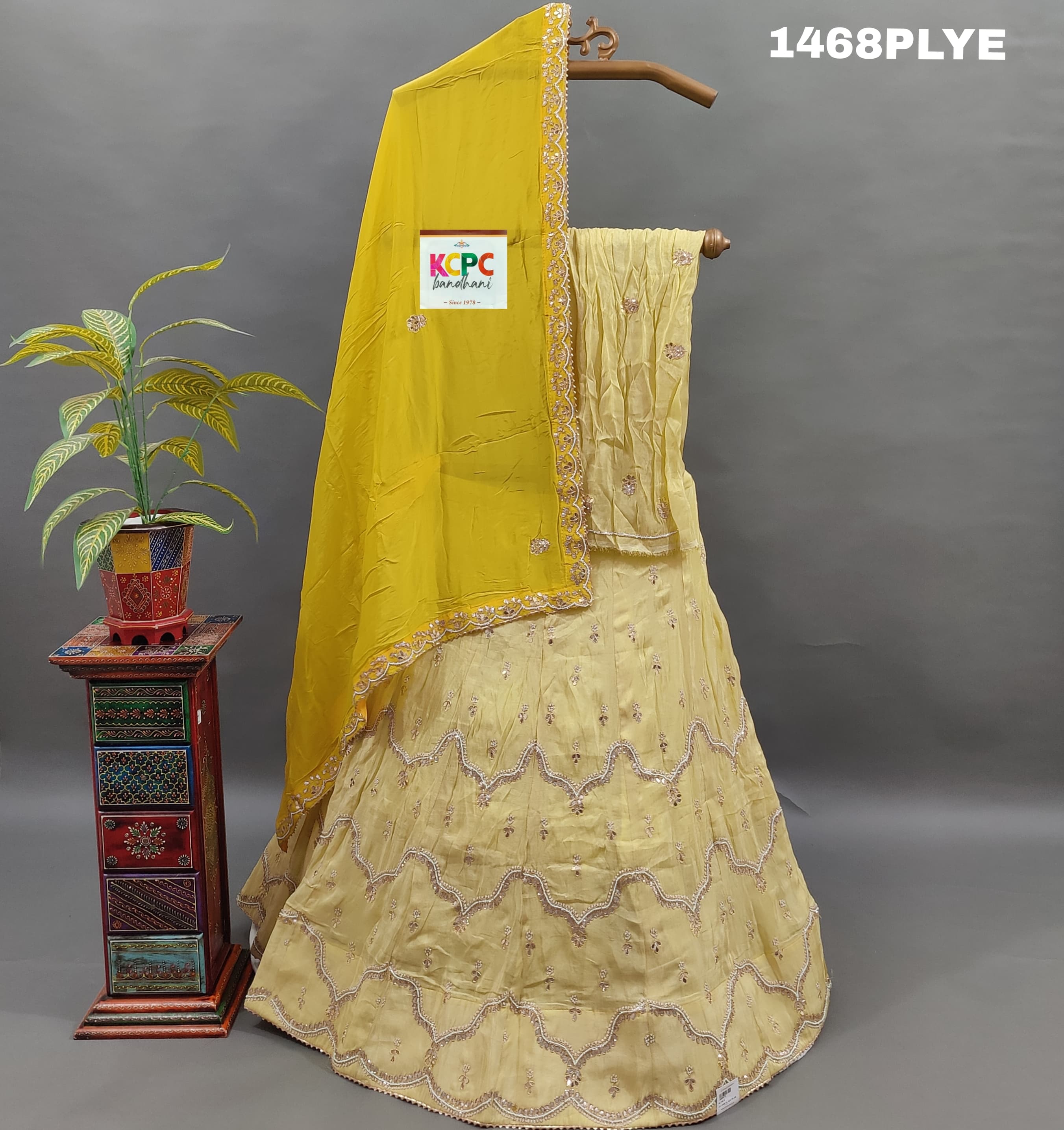 A yellow lehenga with gota work and zardoji 