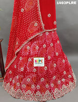 A red lehenga with gota work