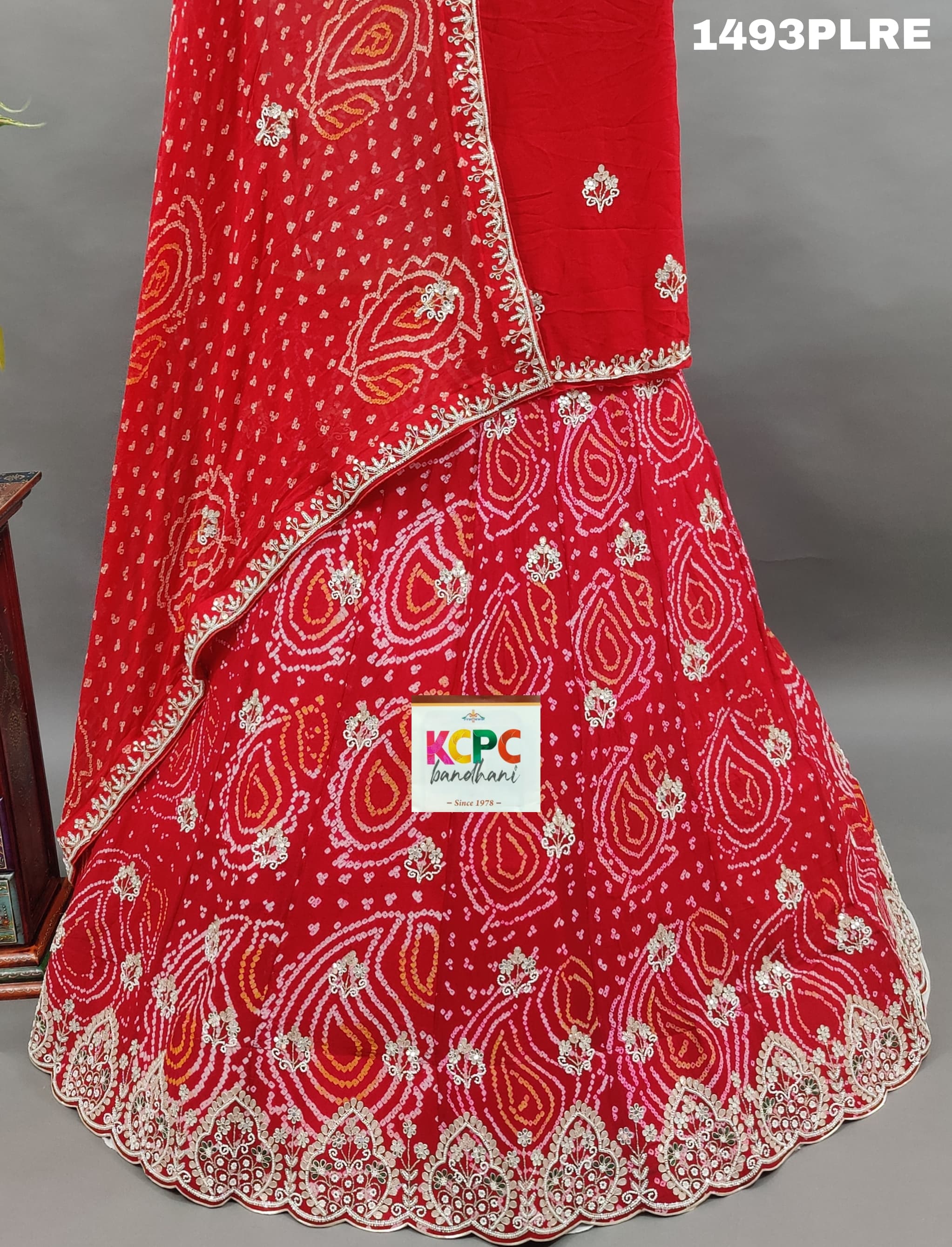 A red lehenga with gota work