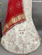 A red and white traditional lehenga with bandhani dupatta and zardoji gotapatti work
