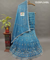 A blue and white traditional lehenga with cutdana beadwork 