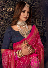 A traditional pink saree with mirror work