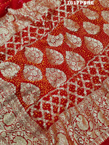 A red khaddi georgette saree with banarasi zari
