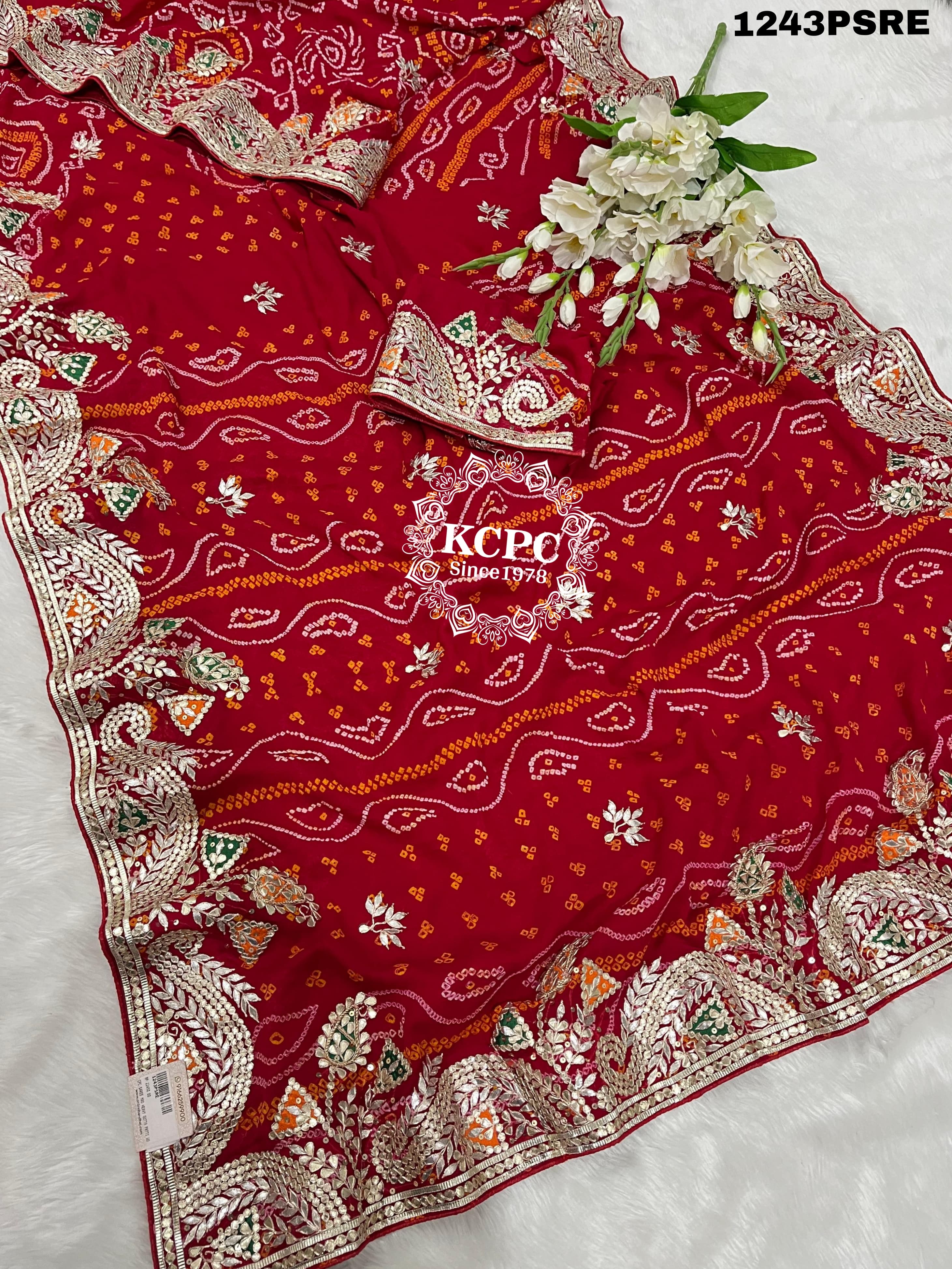 A red bandhani saree with gota patti work