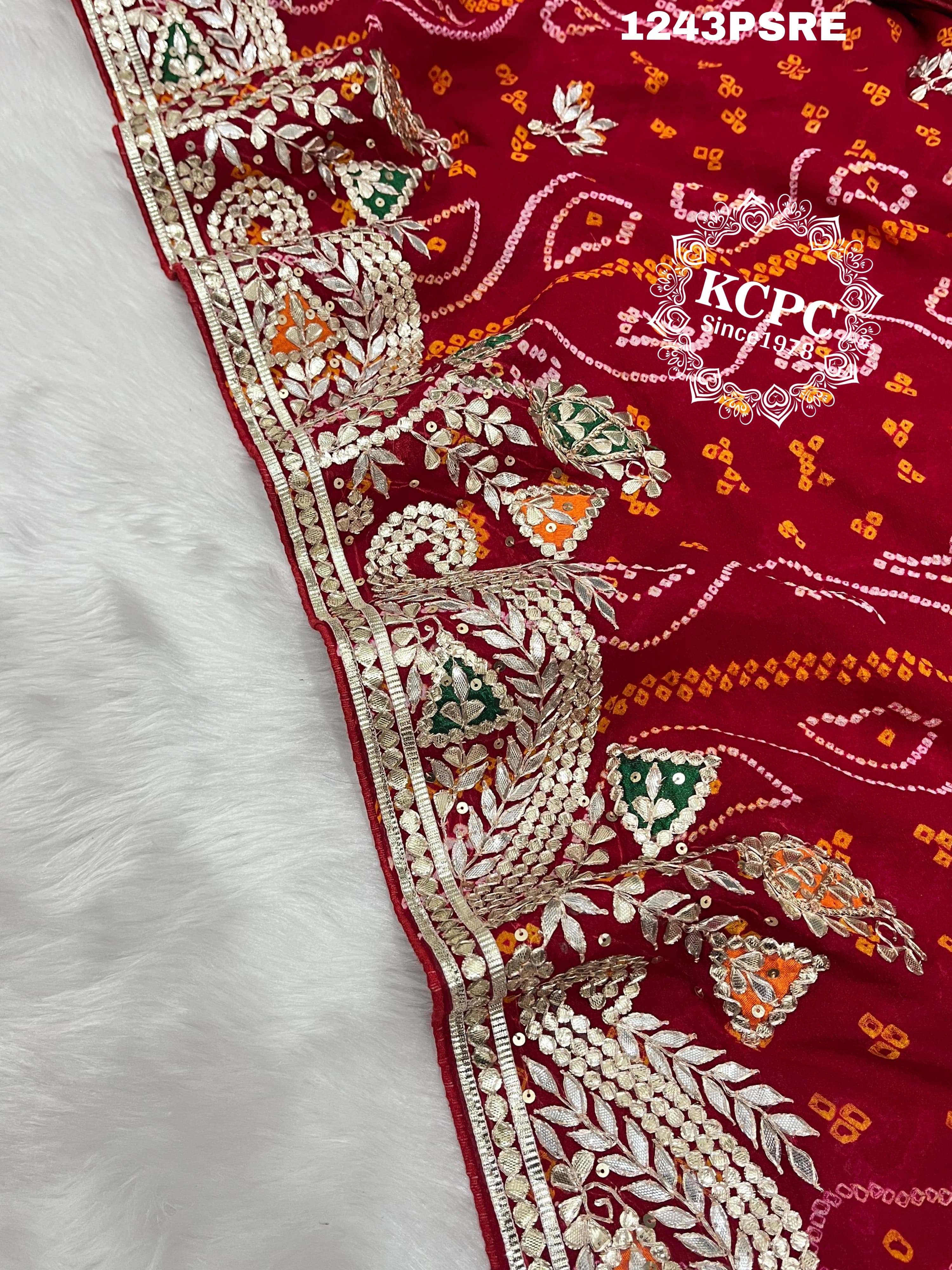 A red bandhani saree with gota patti work