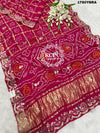 A pink and red pure gaji silk saree with bandhani style