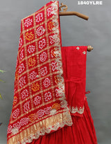 A red pure gaji silk lehenga with bandhani gharchola dupatta