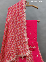 A traditional wear lehenga set with bandhani print and white bead work