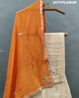 A traditional Indian lehenga with beige and orange colors.