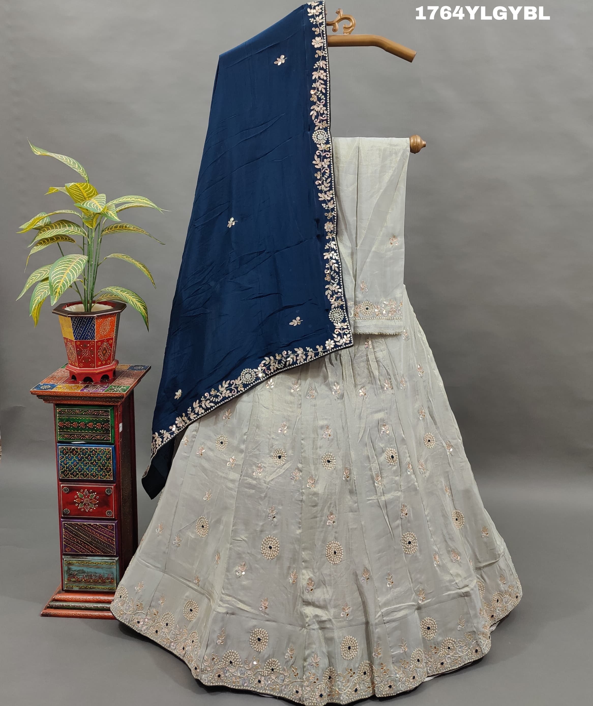A traditional Indian lehenga set with gotapatti work