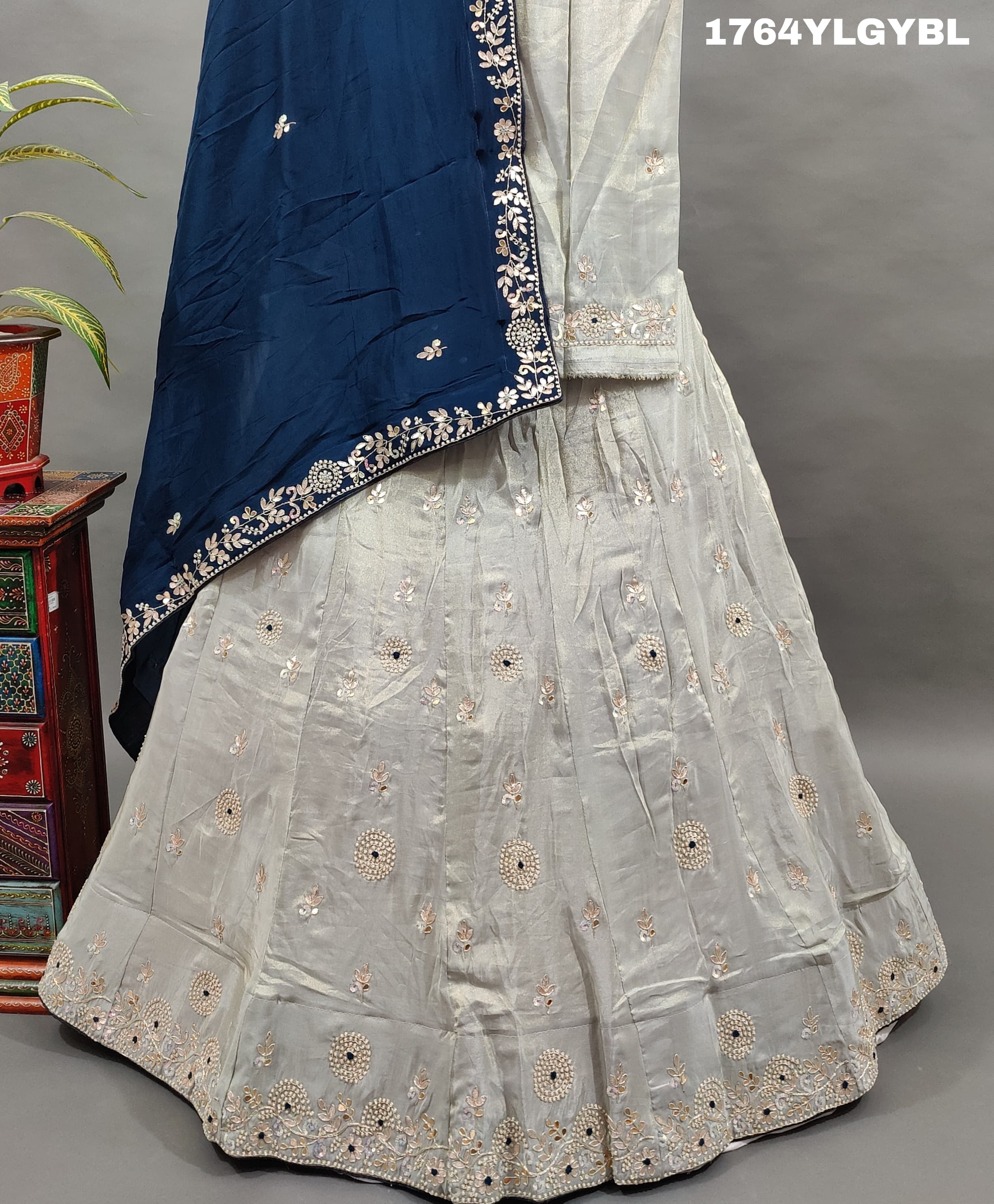 A traditional Indian lehenga set with gotapatti work