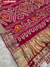 red silk saree with gotapatti work and floral embellishments 
