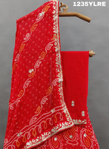 A red lehenga set with gota patti work 