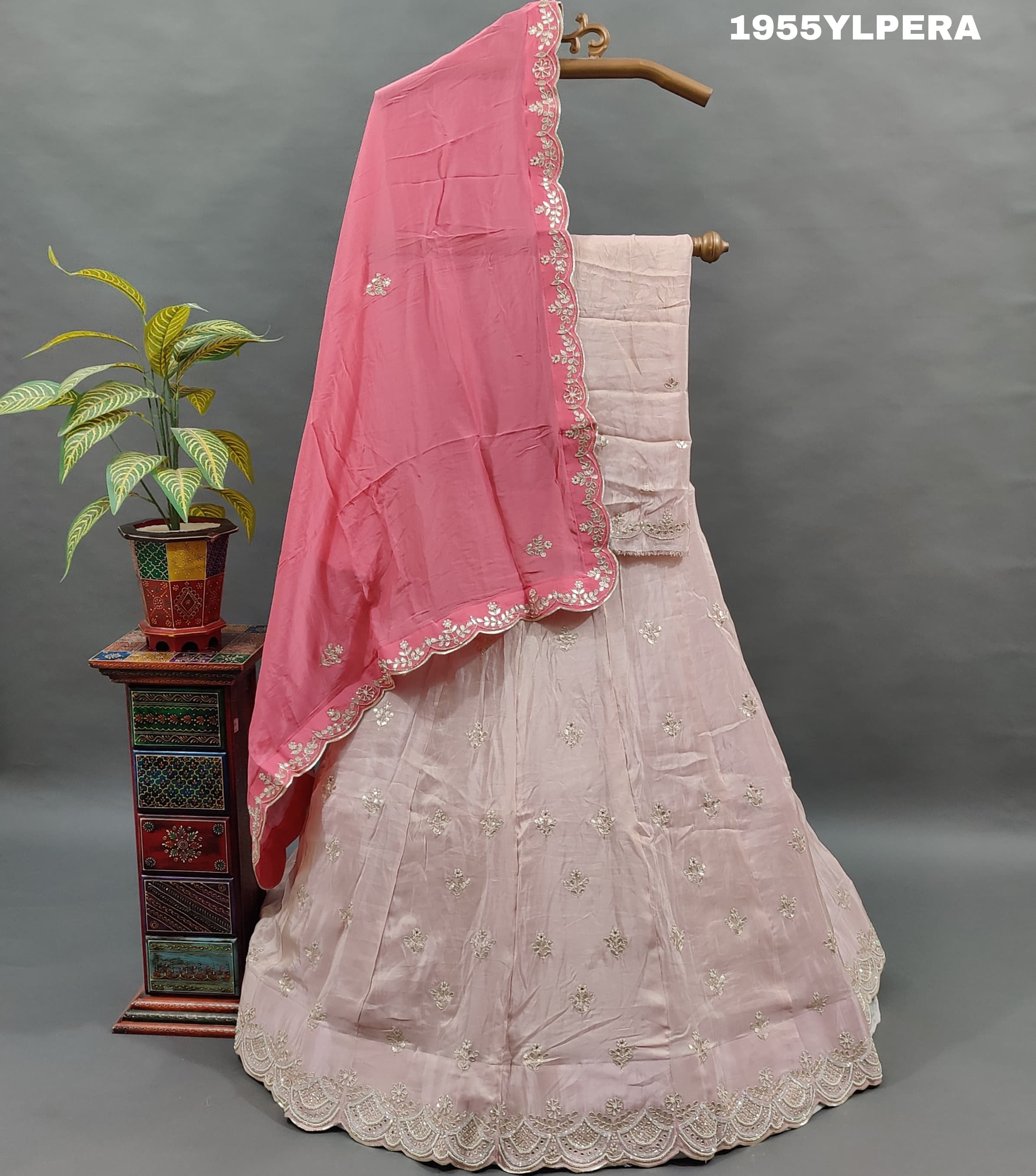 A pink silk lehenga set with gota work 