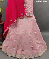 A pink silk lehenga set with Gotapati work and a dupatta