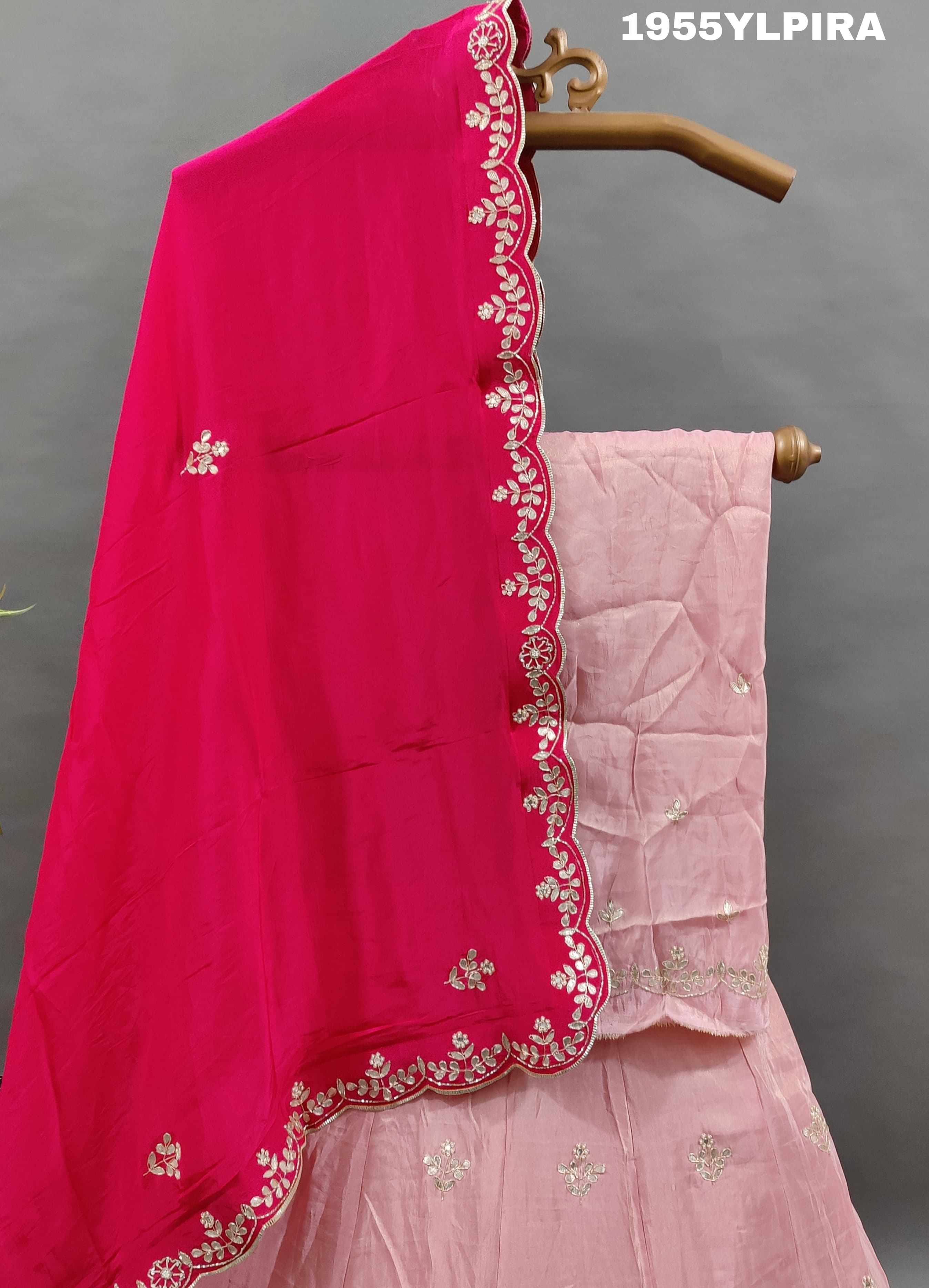 A pink silk lehenga set with Gotapati work and a dupatta