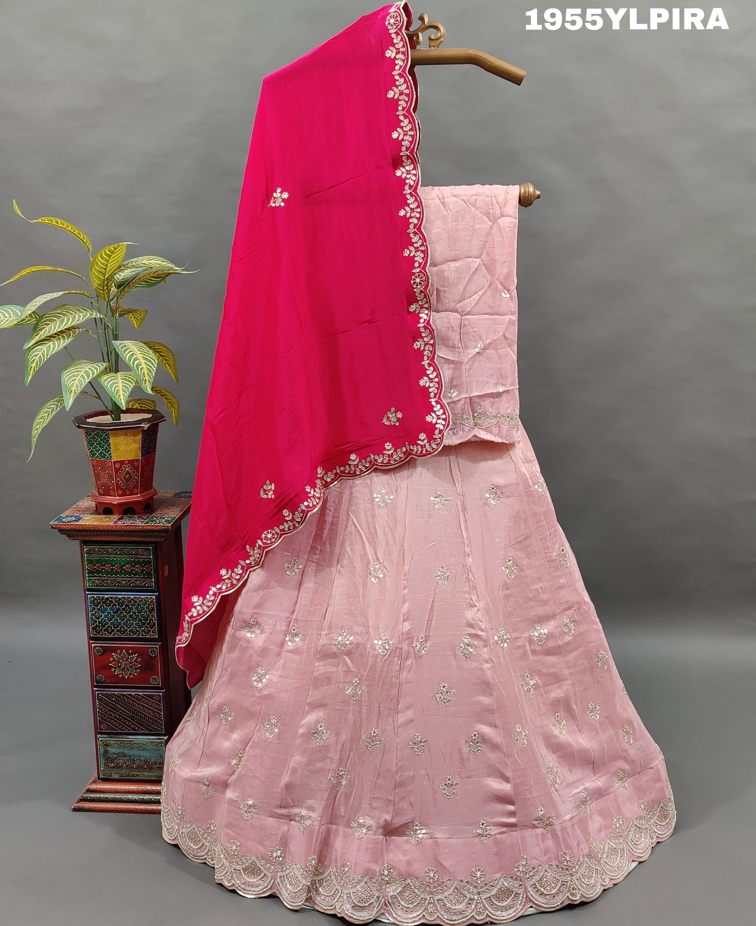 A pink silk lehenga set with Gotapati work and a dupatta