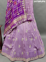 A traditional purple lehenga with Gatapati work 