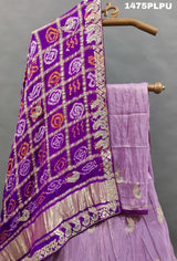 A traditional purple lehenga with Gatapati work 
