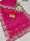 A pink saree with Bandhej pattern and Gotapatti work