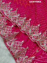 A pink saree with Bandhej pattern and Gotapatti work