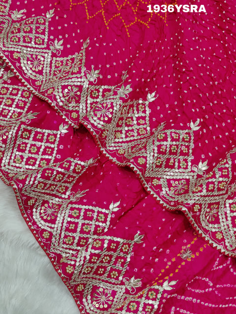 A pink saree with Bandhej pattern and Gotapatti work