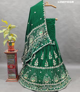 A green lehenga set with gotapati work