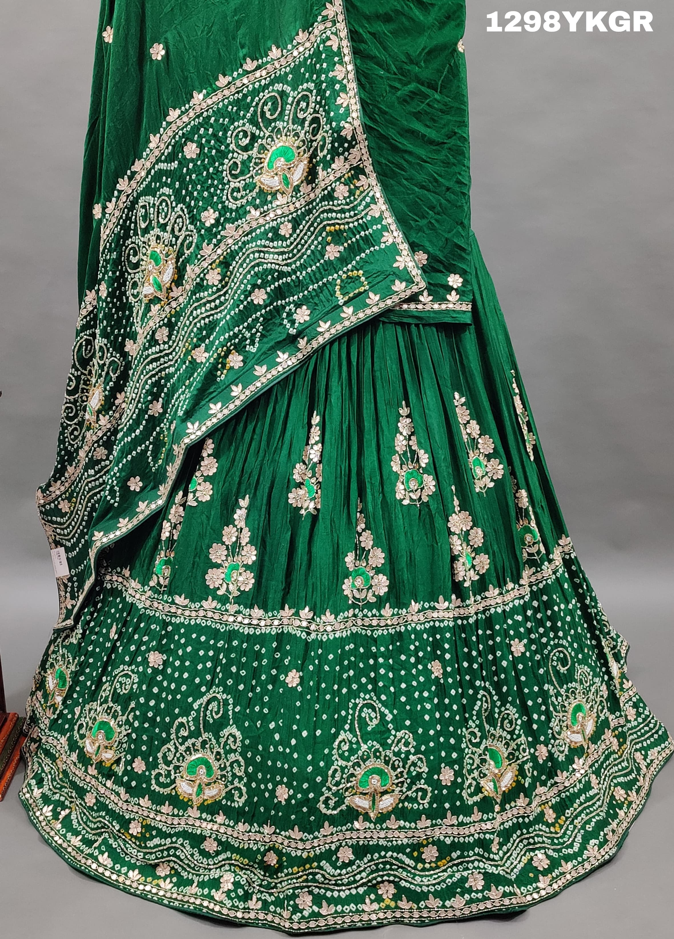 A green lehenga set with gotapati work