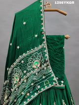 A green lehenga set with gotapati work