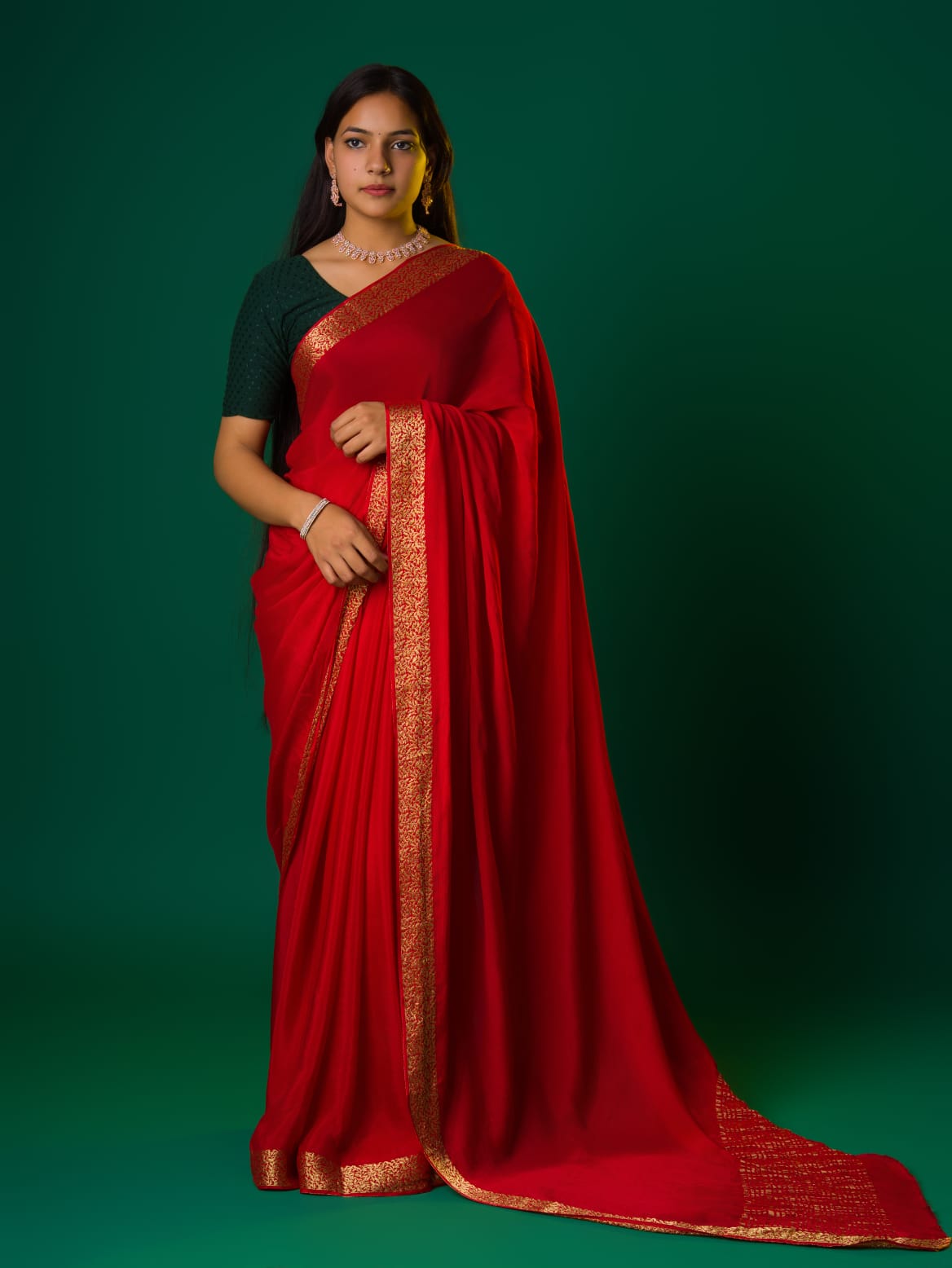 Ared saree with a zari border