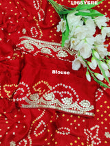 A red and gold modal silk saree with gota patti work