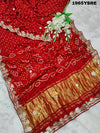 A red and gold modal silk saree with gota patti work