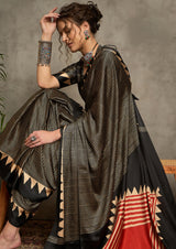 A black and gray silk saree with a geometric ajrakh print