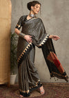 A black and gray silk saree with a geometric ajrakh print