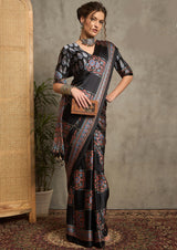 A black saree with red and blue floral ajrak print