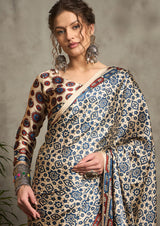 A cream-colored silk saree with a geometric ajrak print.